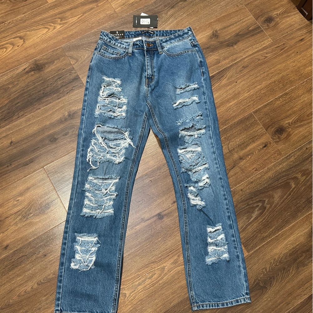 Ripped jeans never used